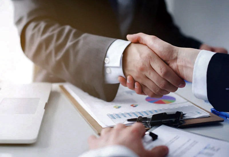Handshake over car financing agreement